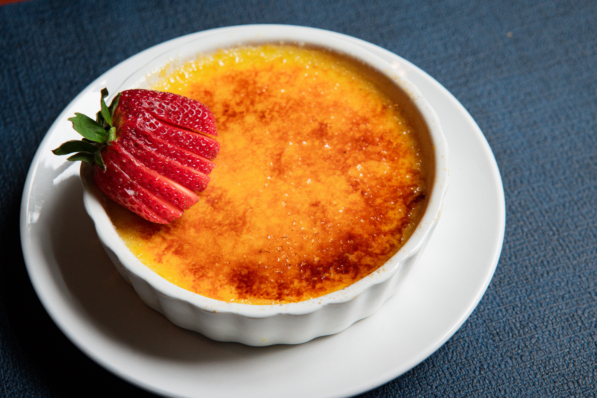 creme brûlée with a fancy strawberry on top